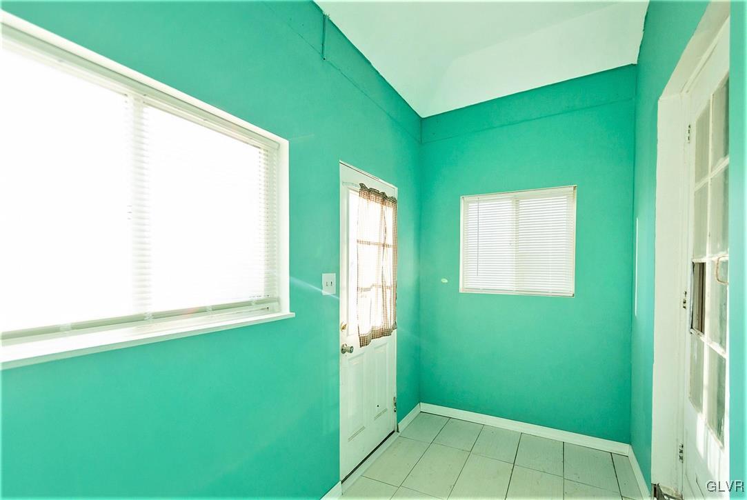 917 High Street Bethlehem, PA 18018 - Photo 13 of 25 a view of an empty room with window and stairs