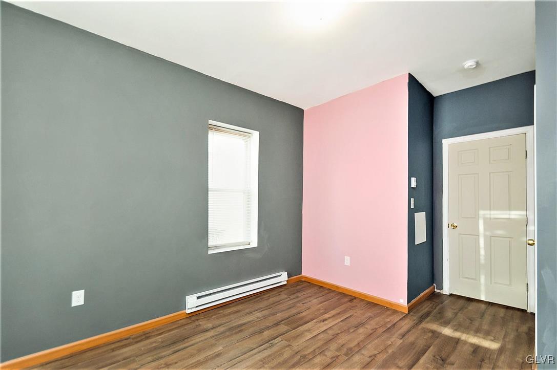 917 High Street Bethlehem, PA 18018 - Photo 16 of 25 an empty room with wooden floor and windows