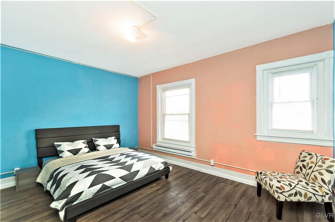 917 High Street Bethlehem, PA 18018 - Photo 18 of 25 a bedroom with a bed and wooden floor