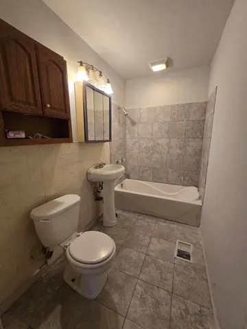 a view of a room with gym equipment and windows