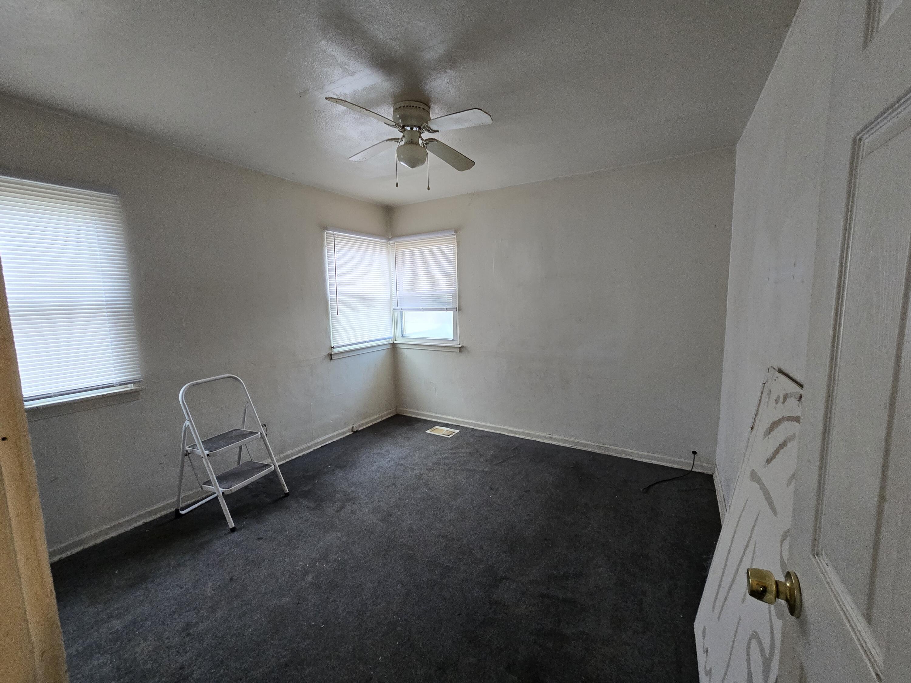 1119 Cass Street Gary, IN 46403 - Photo 13 of 20 a view of a room with gym equipment and windows