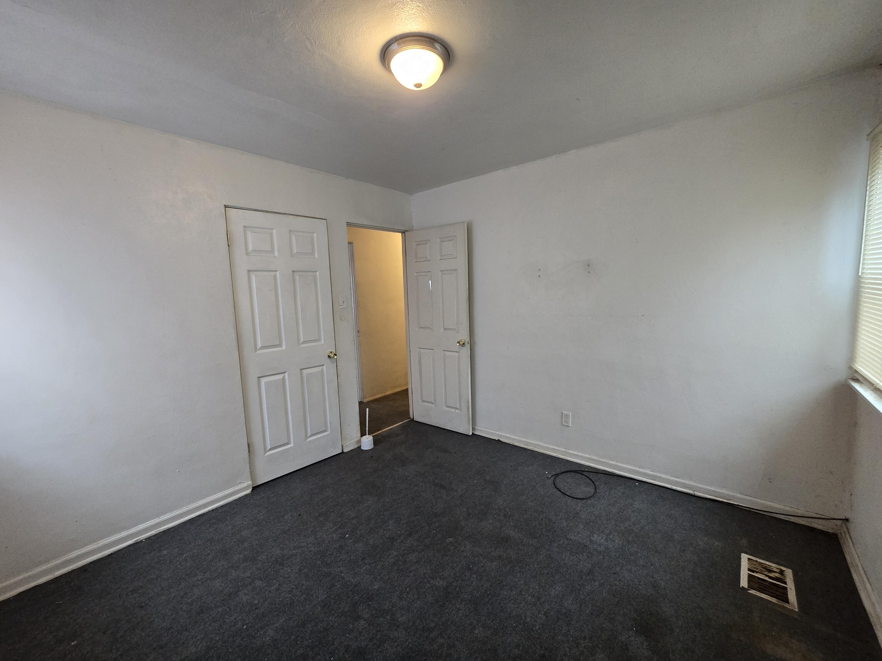 1119 Cass Street Gary, IN 46403 - Photo 16 of 20 an empty room with a door