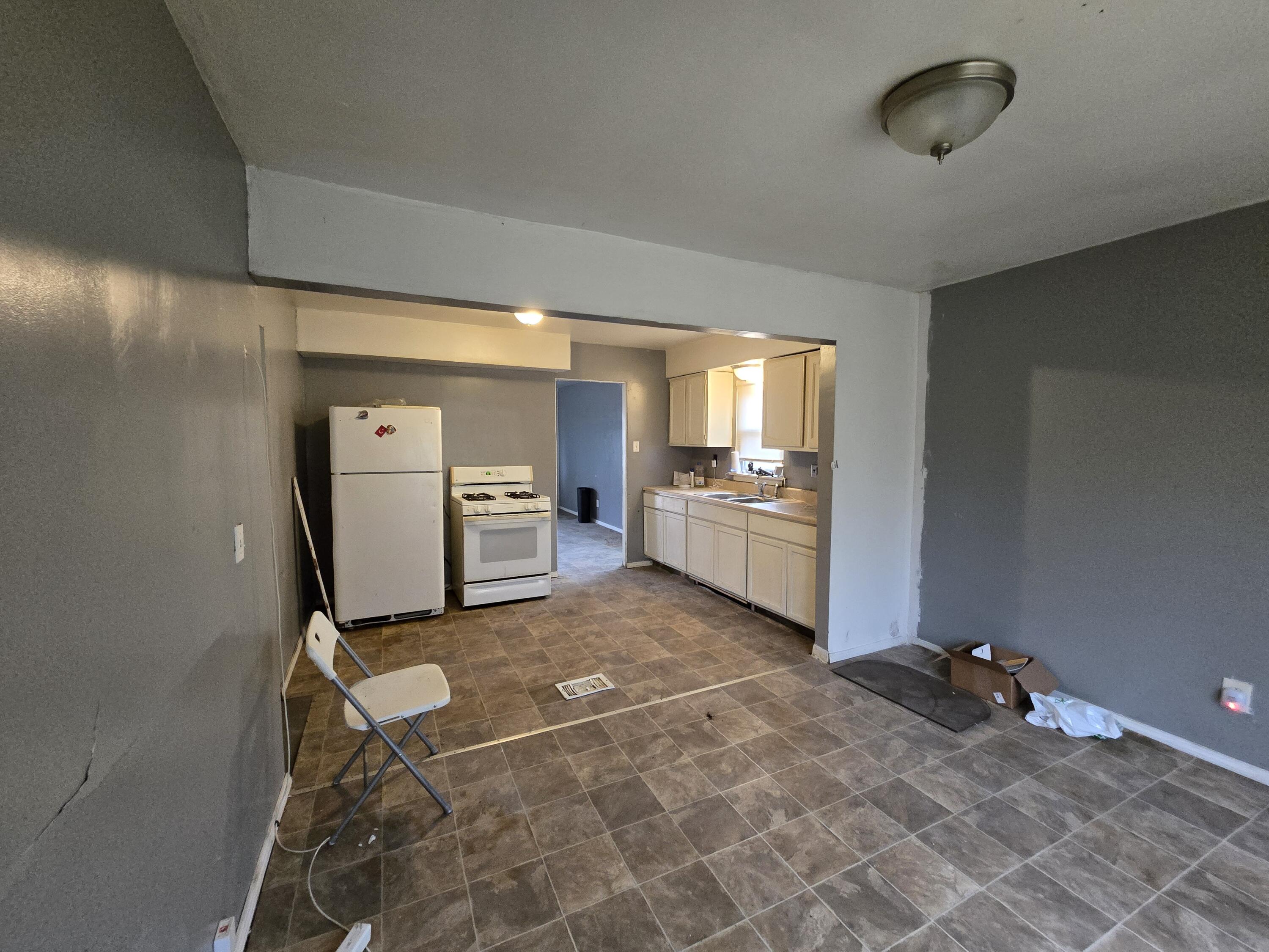 1119 Cass Street Gary, IN 46403 - Photo 5 of 20 a view of a kitchen with refrigerator and window