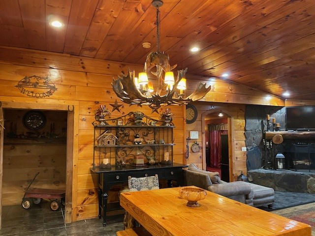 911 Summit Way Blairsville, GA 30512 - Photo 12 of 15 a room with fountain in front of it and a chandelier