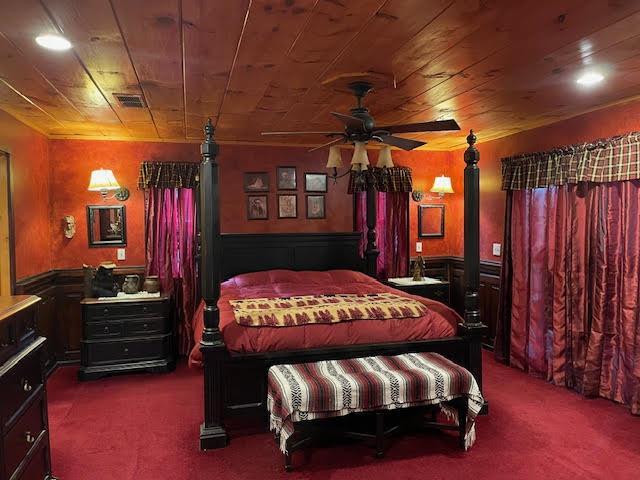 911 Summit Way Blairsville, GA 30512 - Photo 2 of 15 a bedroom with bed and a chandelier