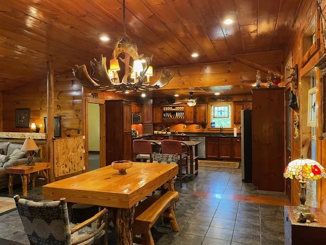 a dinning table and chairs in a room