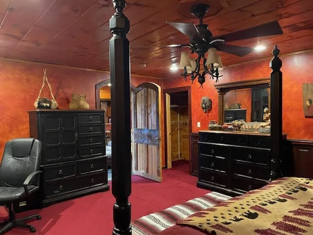 a room with a bed and a dresser