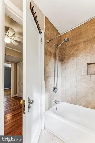 a bathroom with a tub and shower