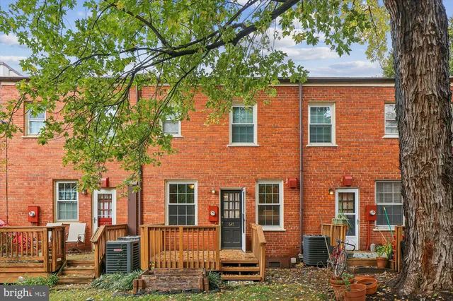 front view of a house with a tree