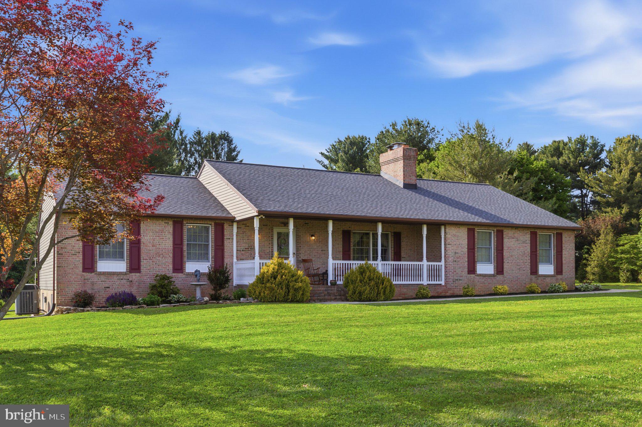 18310 Upper Beckleysville Road Hampstead, MD 21074 - Photo 1 of 67 Charming brick home with lush greenery.