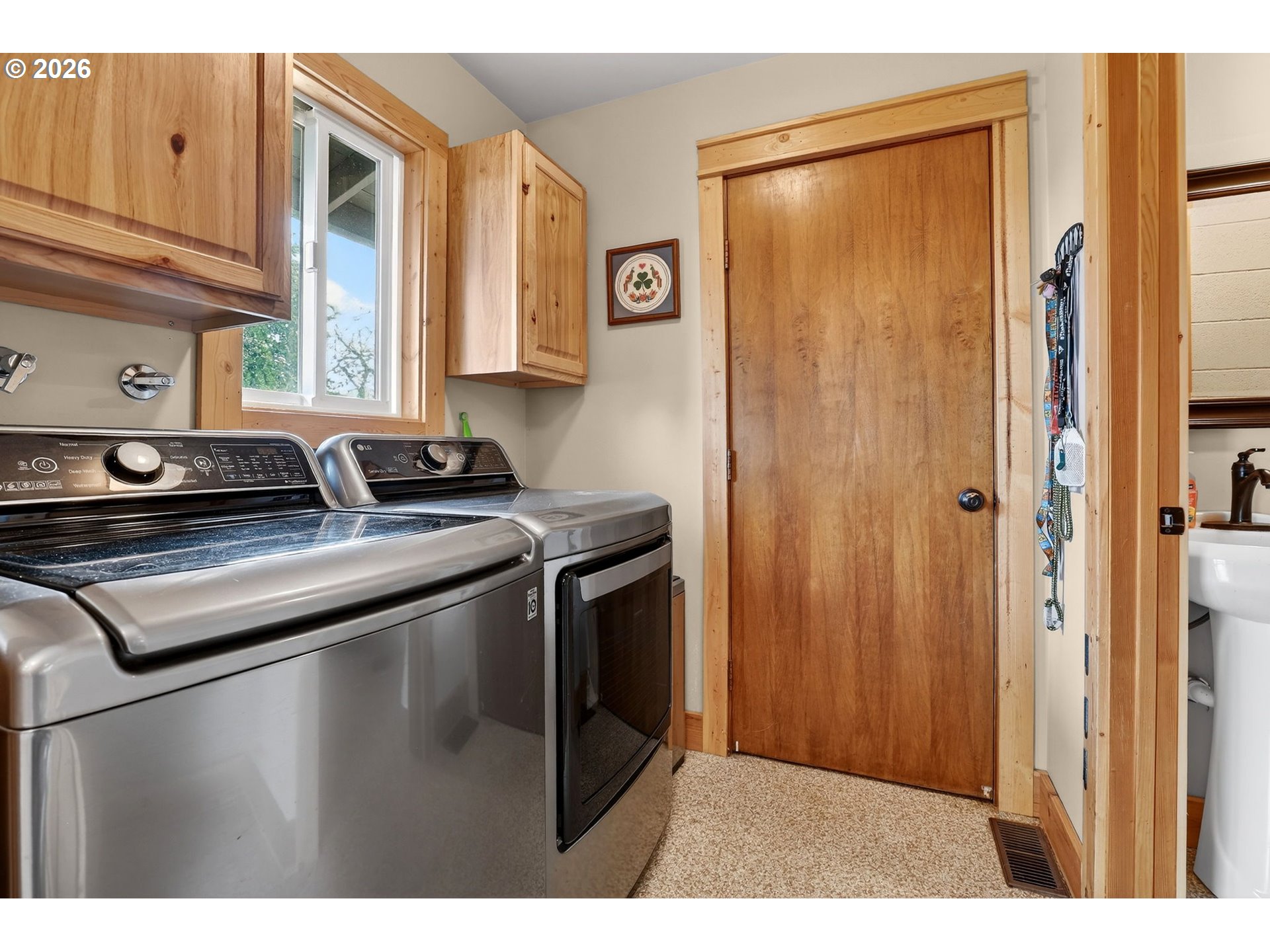 9732 Southeast Ladera Court Damascus, OR 97089 - Photo 19 of 41 a kitchen with stainless steel appliances granite countertop a sink a stove and a refrigerator