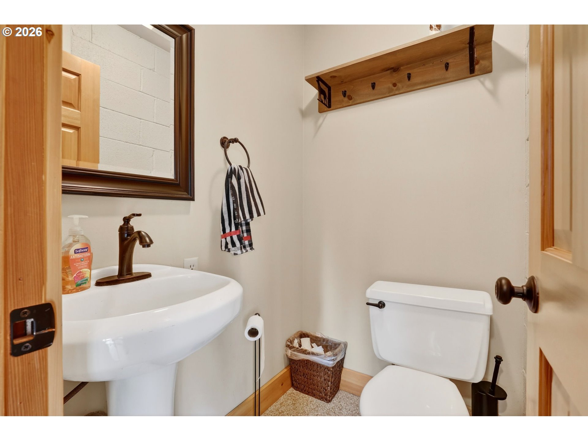 9732 Southeast Ladera Court Damascus, OR 97089 - Photo 20 of 41 a bathroom with a sink toilet and mirror
