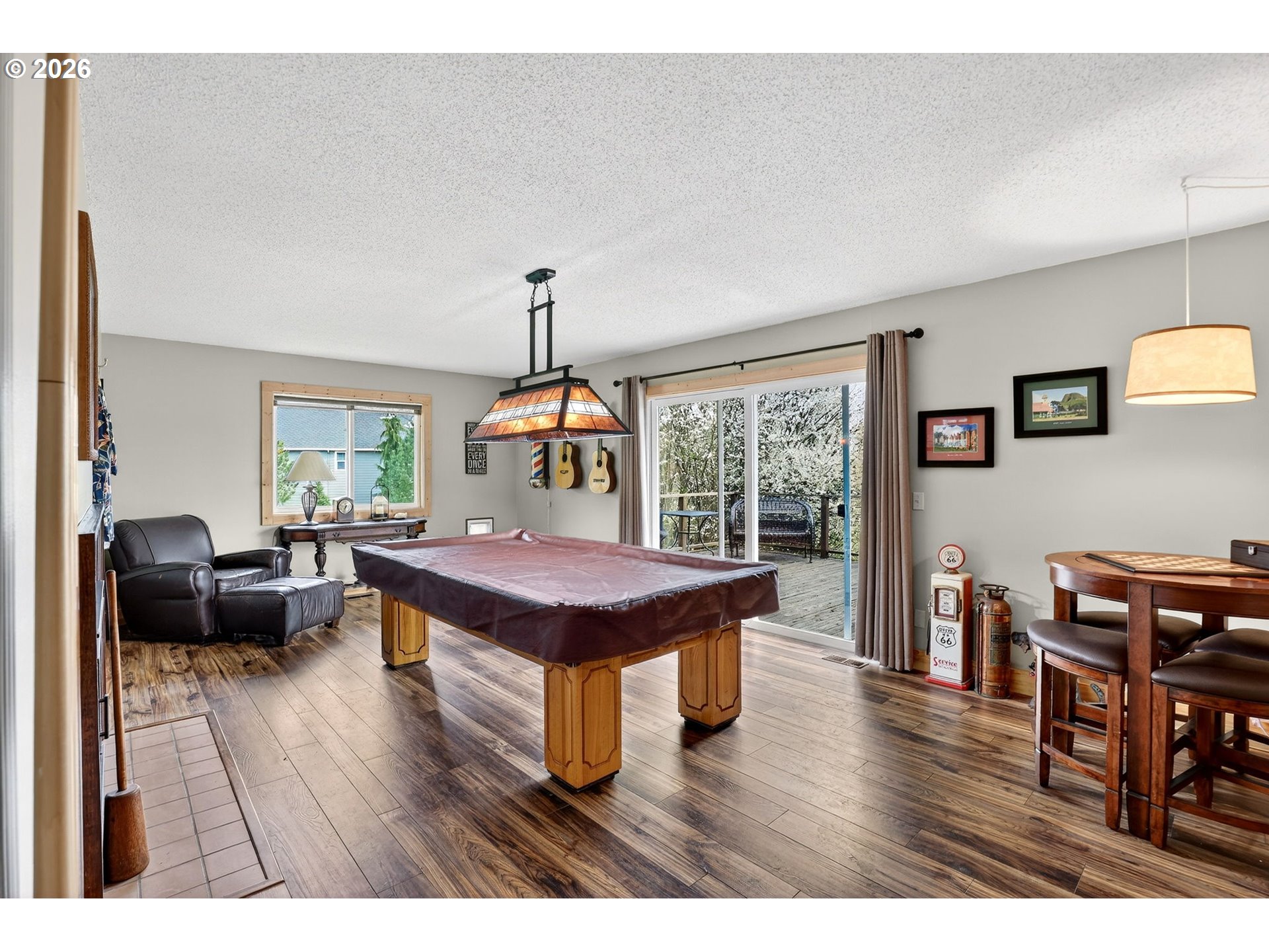 9732 Southeast Ladera Court Damascus, OR 97089 - Photo 21 of 41 a living room with furniture a wooden floor and next to a window