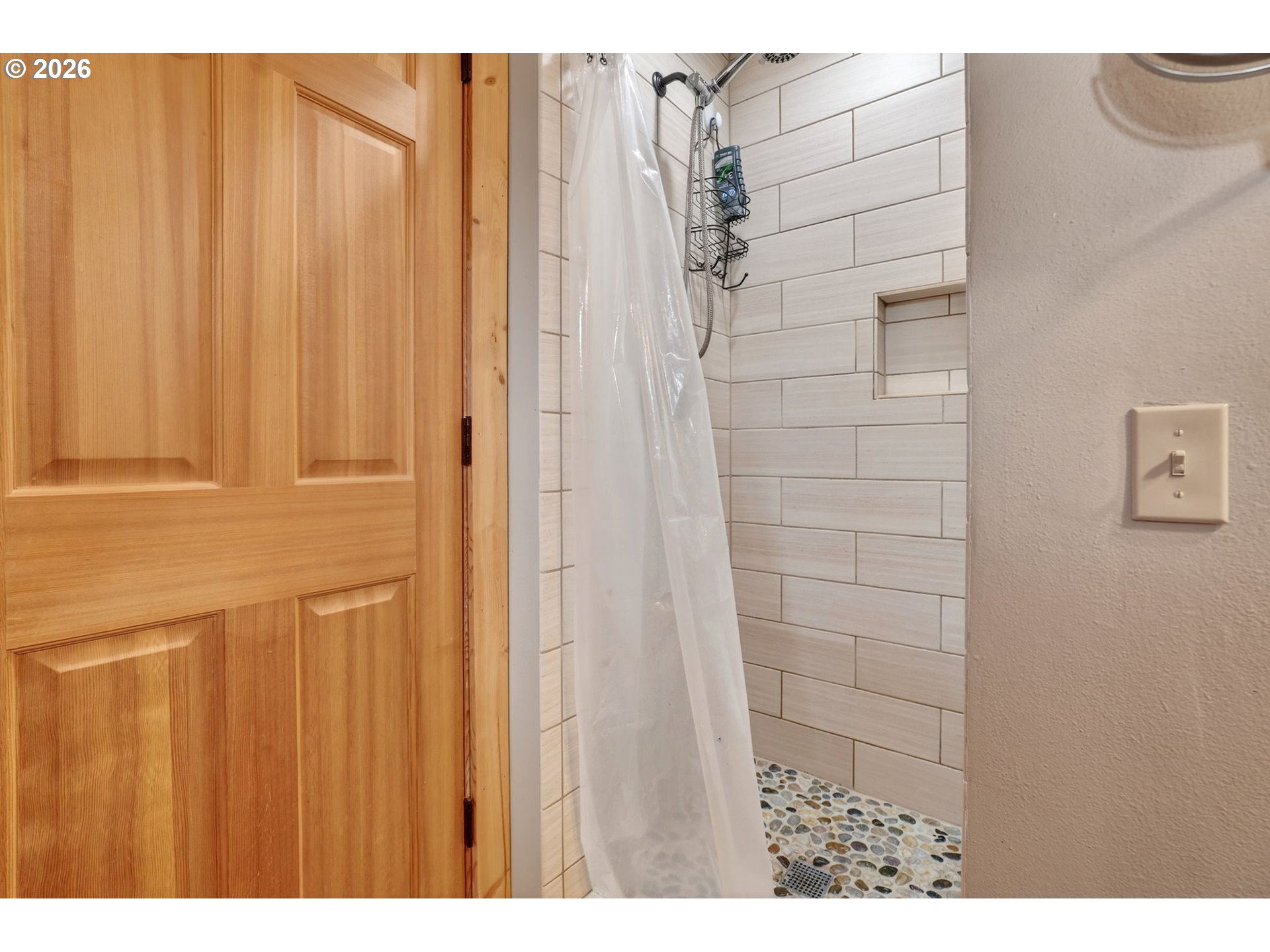 9732 Southeast Ladera Court Damascus, OR 97089 - Photo 26 of 41 a bathroom with a shower curtain