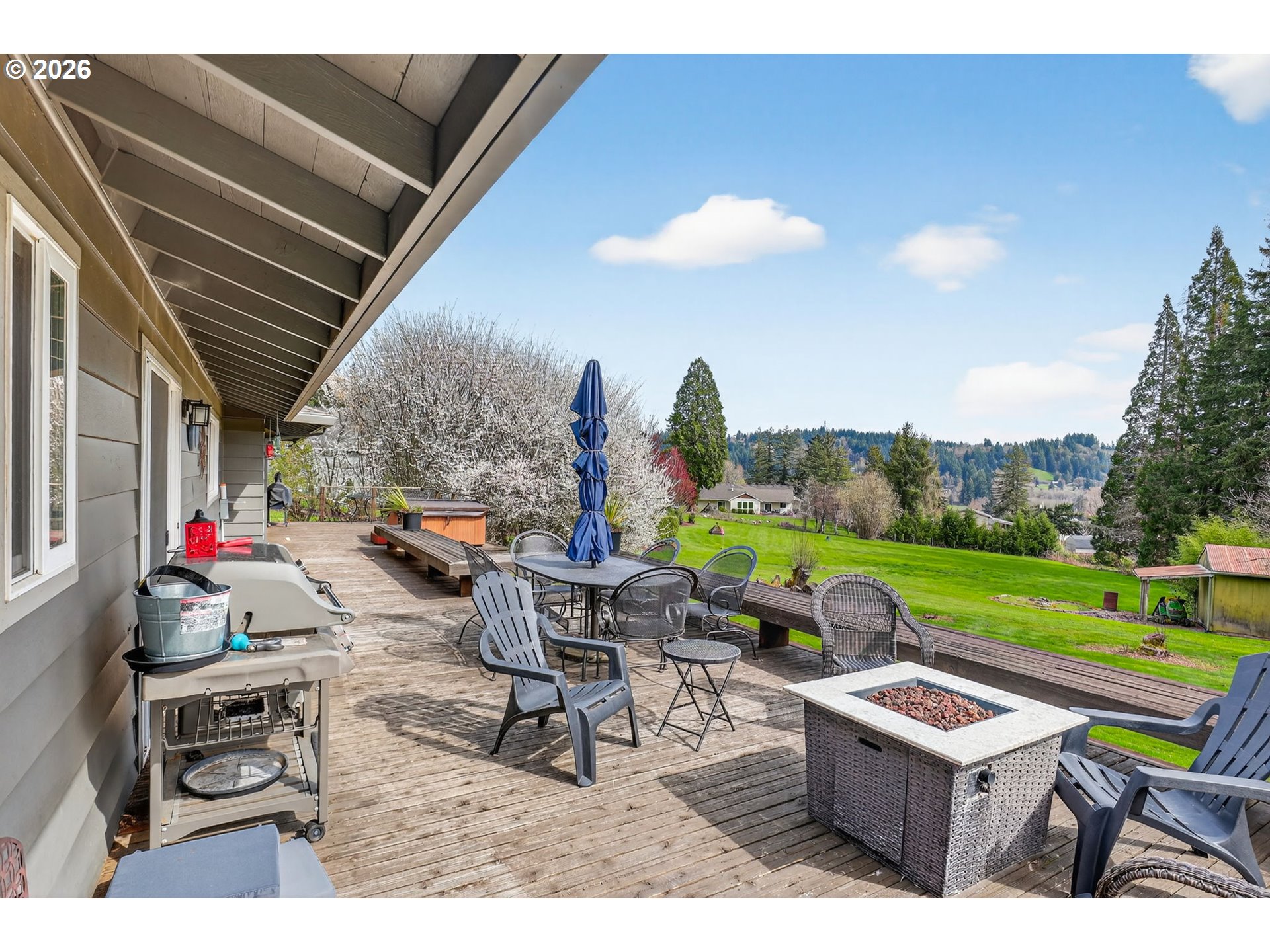 9732 Southeast Ladera Court Damascus, OR 97089 - Photo 29 of 41 a backyard of a house with outdoor seating