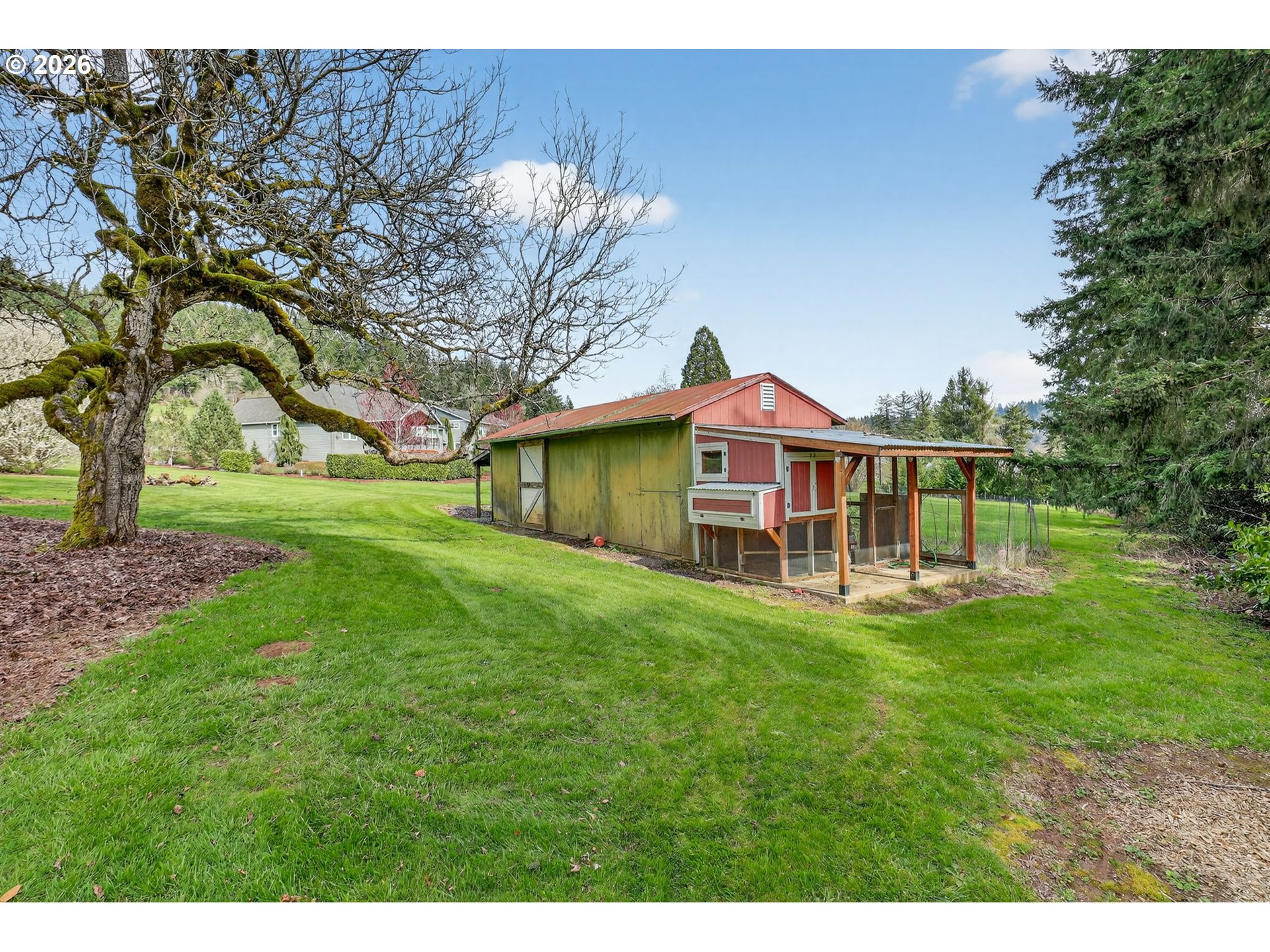 9732 Southeast Ladera Court Damascus, OR 97089 - Photo 35 of 41 a view of a house with a big yard