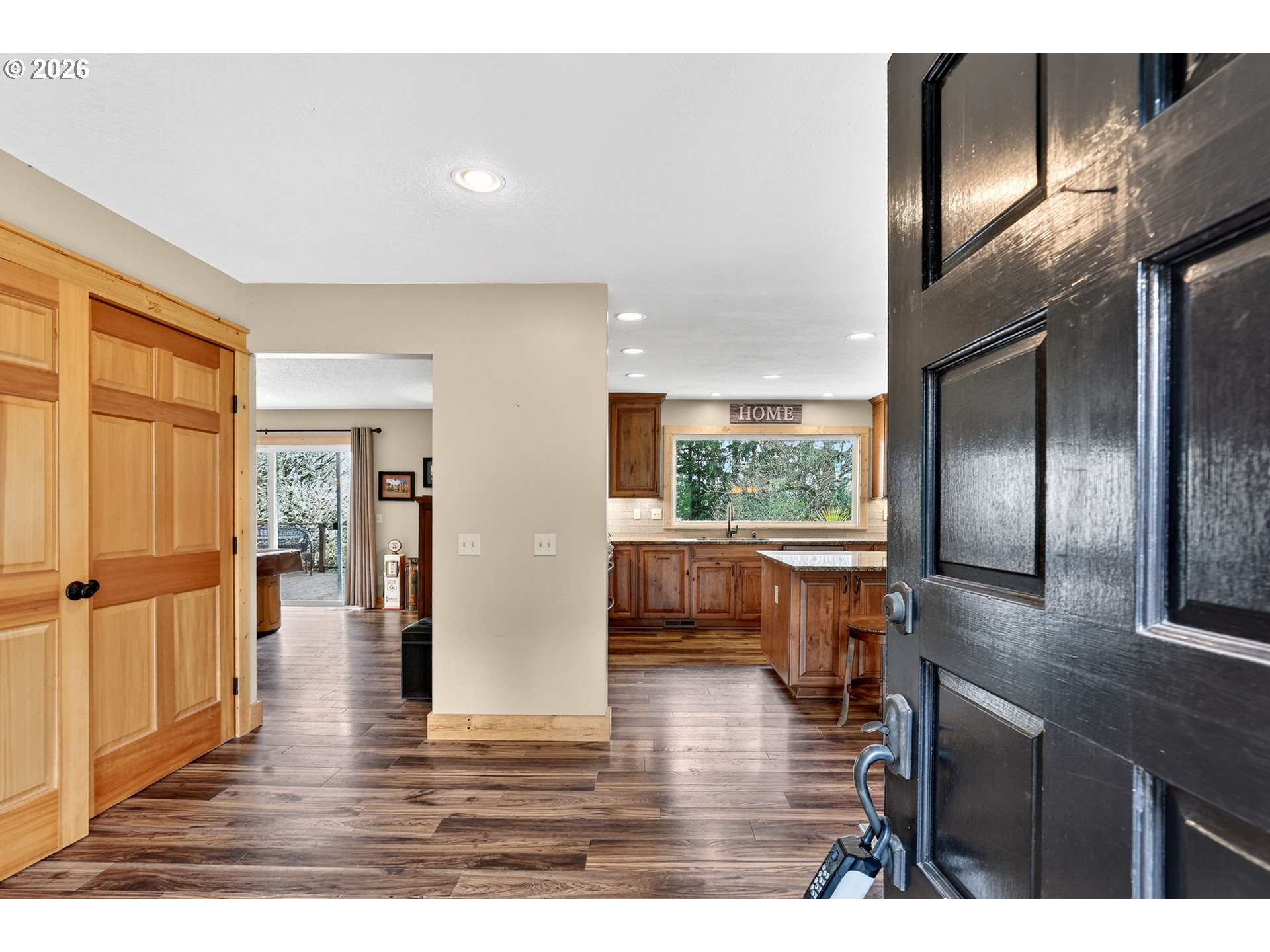 9732 Southeast Ladera Court Damascus, OR 97089 - Photo 4 of 41 a open kitchen with stainless steel appliances granite countertop a refrigerator and a sink