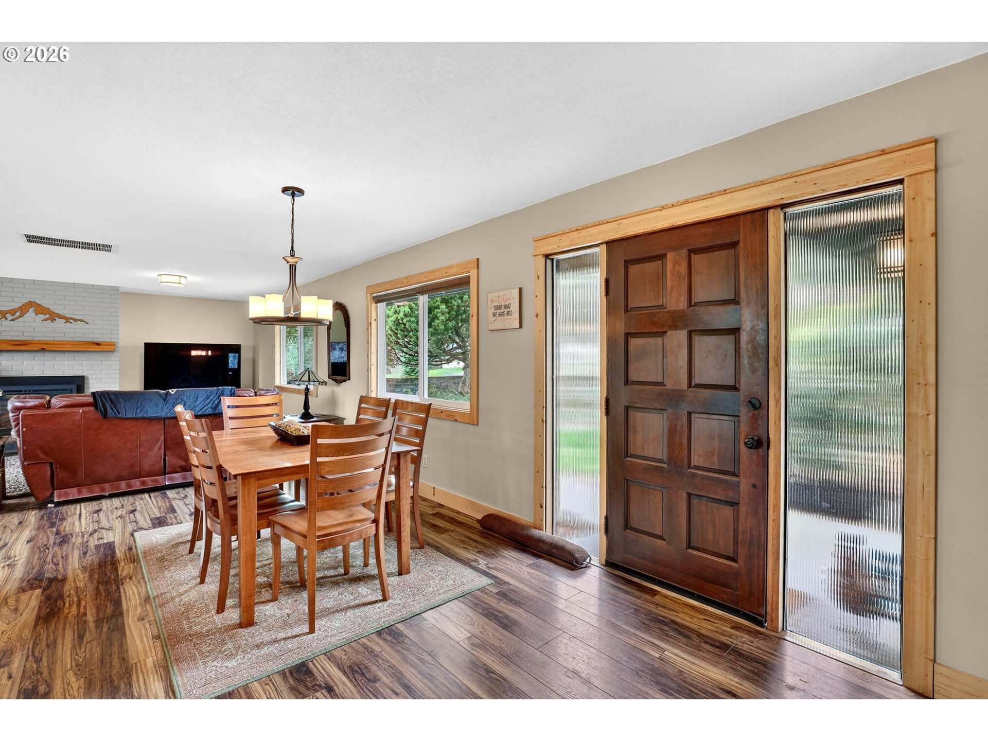 9732 Southeast Ladera Court Damascus, OR 97089 - Photo 5 of 41 a view of a dining room with furniture window and wooden floor