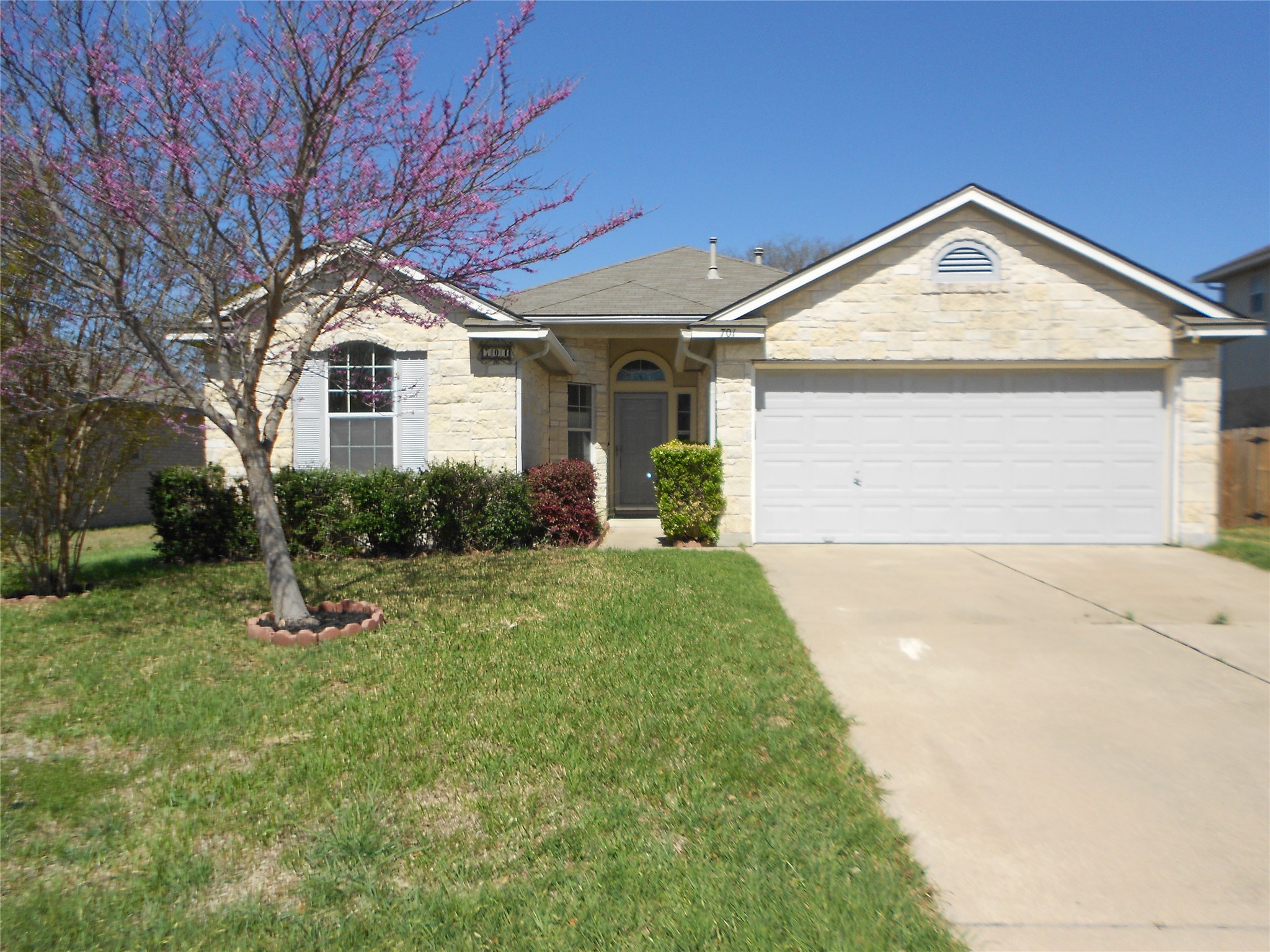 701 Los Robles Road Leander, TX 78641 - Photo 1 of 38 Flat Driveway and Entry into Home