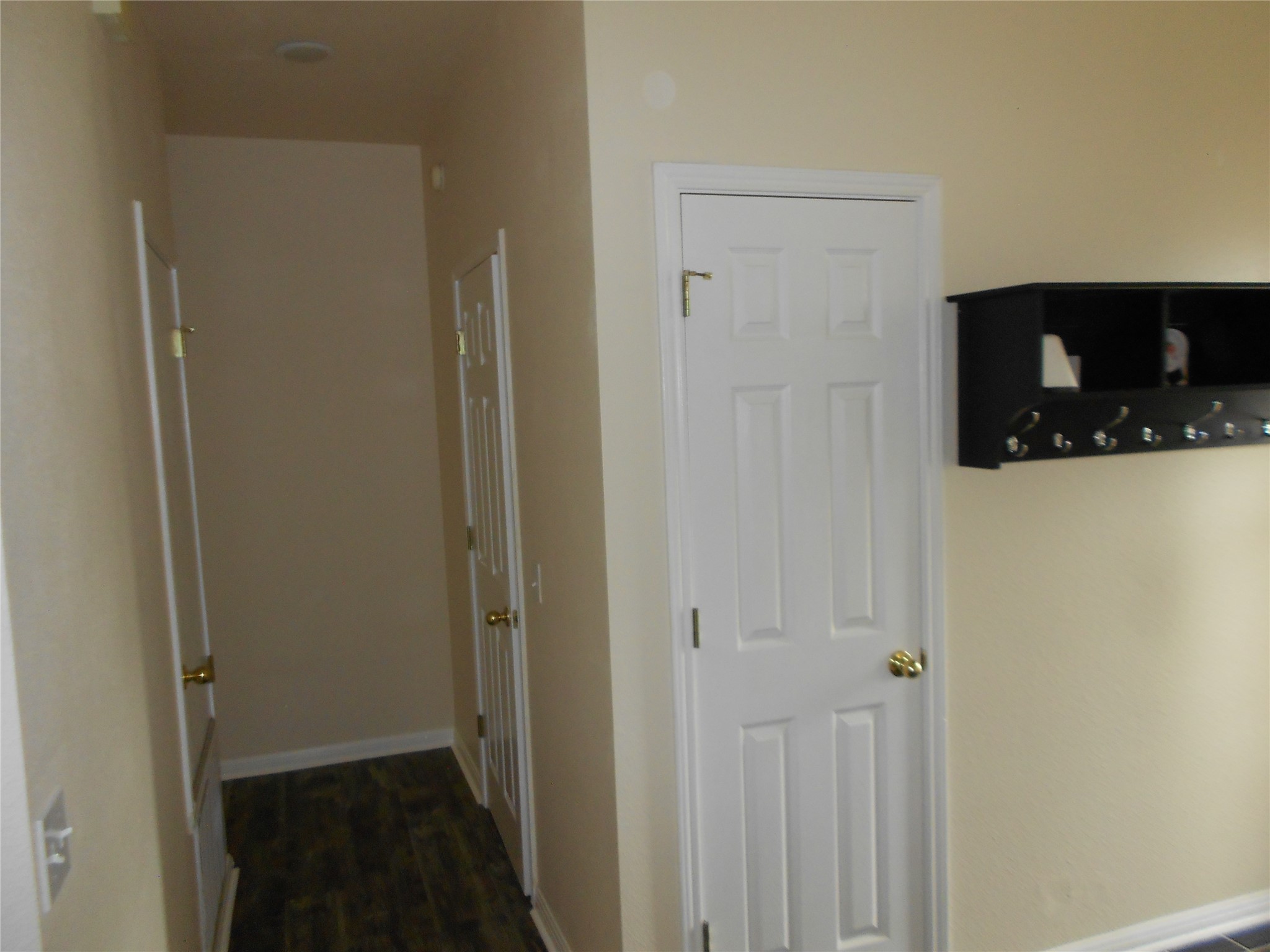 701 Los Robles Road Leander, TX 78641 - Photo 19 of 38 Front Entry with Coat Closet.
Hallway with Utility Room to Right and Primary to Left