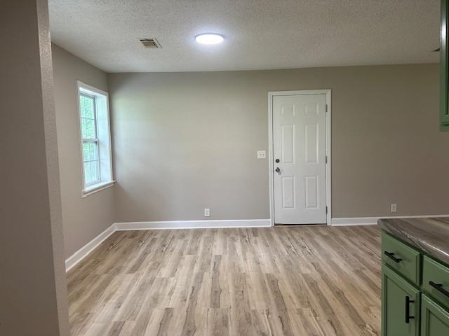 15 Brookwood Loop Adamsville, TN 38310 - Photo 5 of 21 an empty room with wooden floor and windows