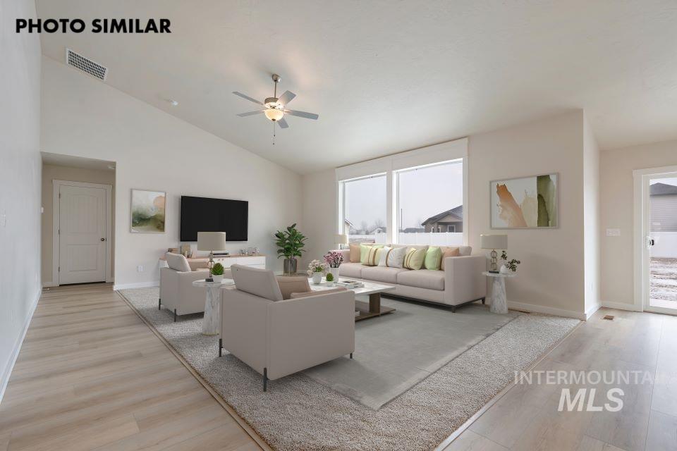 1645 Haystack Emmett, ID 83617 - Photo 5 of 33 Spacious living area featuring a vaulted ceiling and wood-finish flooring
