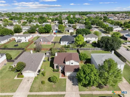 an aerial view of a house with a garden