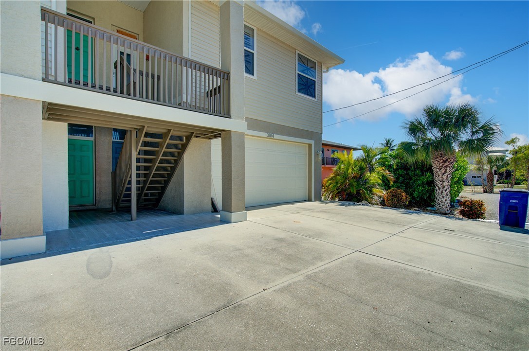 3184 Stringfellow Road St. James City, FL 33956 - Photo 16 of 46 a view of a house with a patio