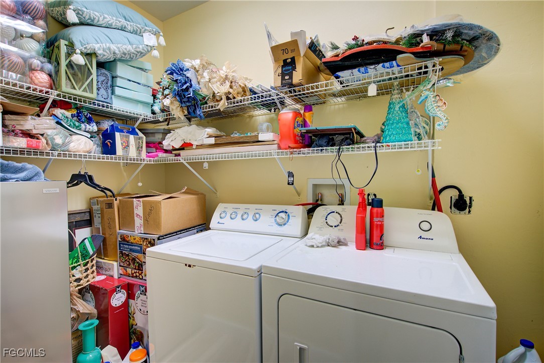3184 Stringfellow Road St. James City, FL 33956 - Photo 22 of 46 a utility room with dryer and washer