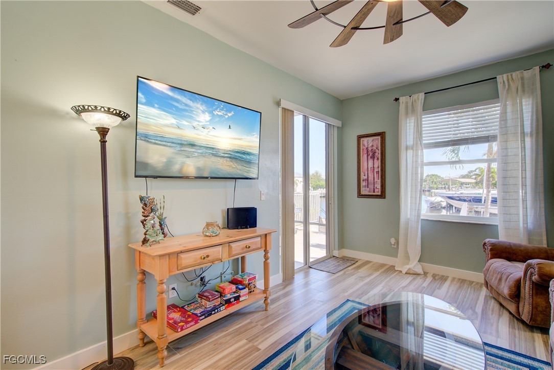 3184 Stringfellow Road St. James City, FL 33956 - Photo 30 of 46 a room with furniture and window