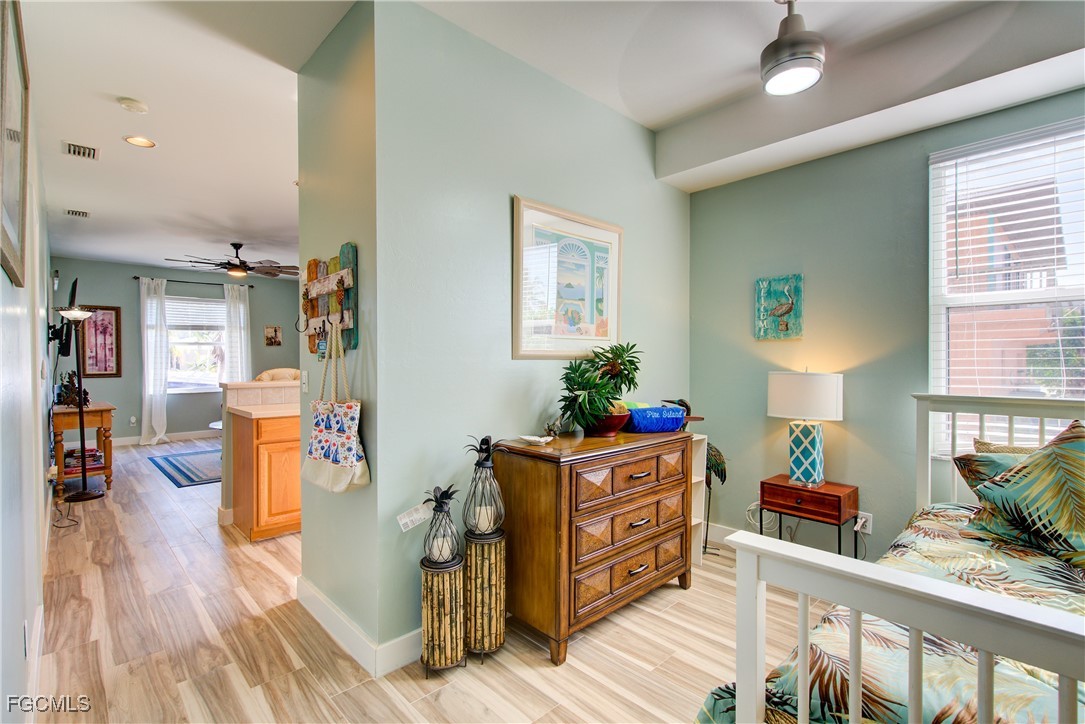 3184 Stringfellow Road St. James City, FL 33956 - Photo 31 of 46 a living room with furniture and a wooden floor