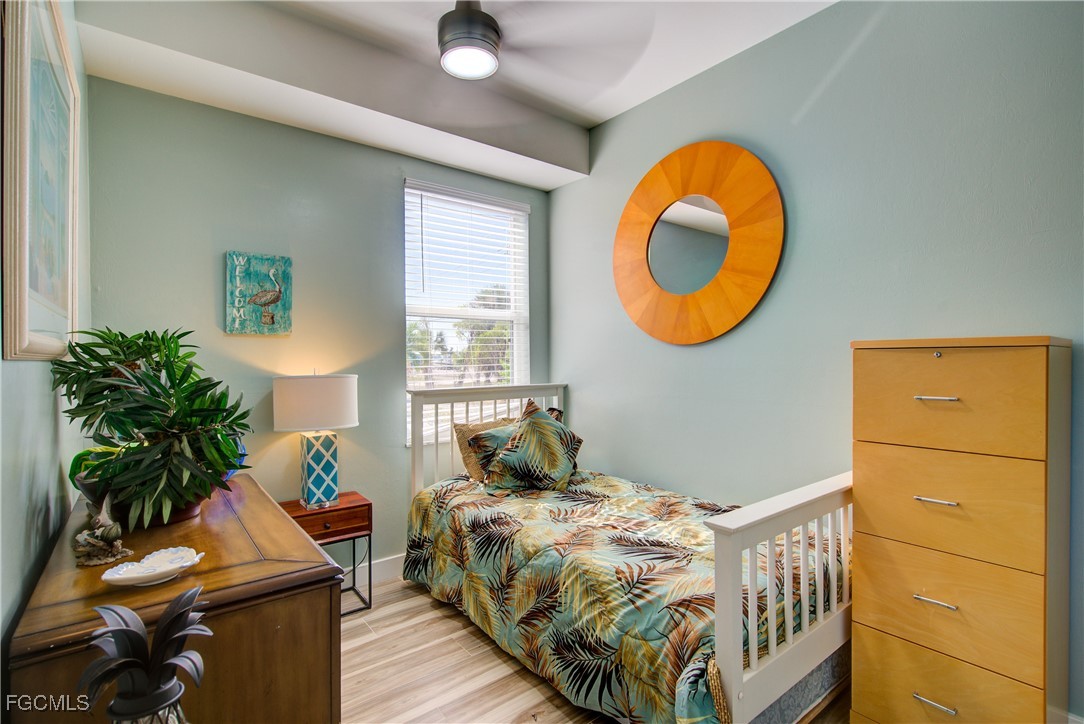 3184 Stringfellow Road St. James City, FL 33956 - Photo 33 of 46 a bedroom with a bed and a window