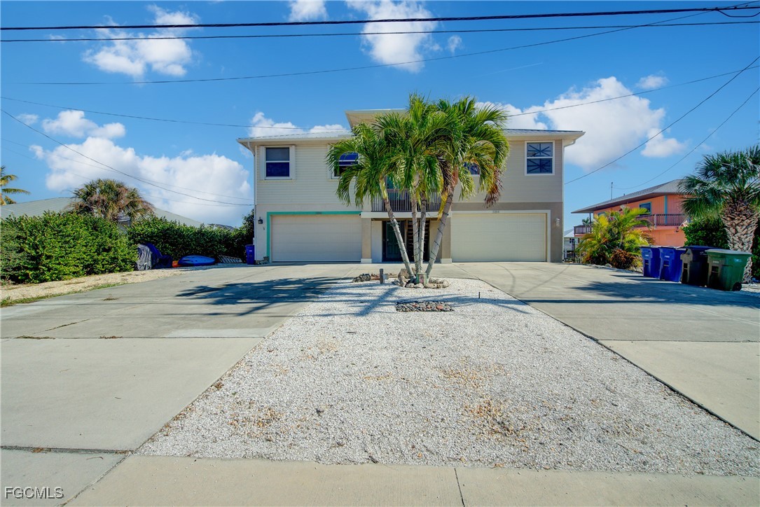 3184 Stringfellow Road St. James City, FL 33956 - Photo 4 of 46 a vase of flowers sitting on a floor