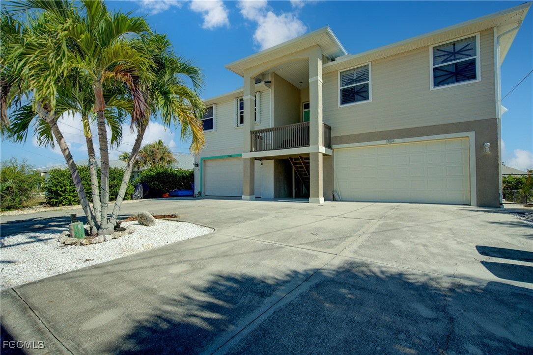 3184 Stringfellow Road St. James City, FL 33956 - Photo 5 of 46 a view of a backyard of a house