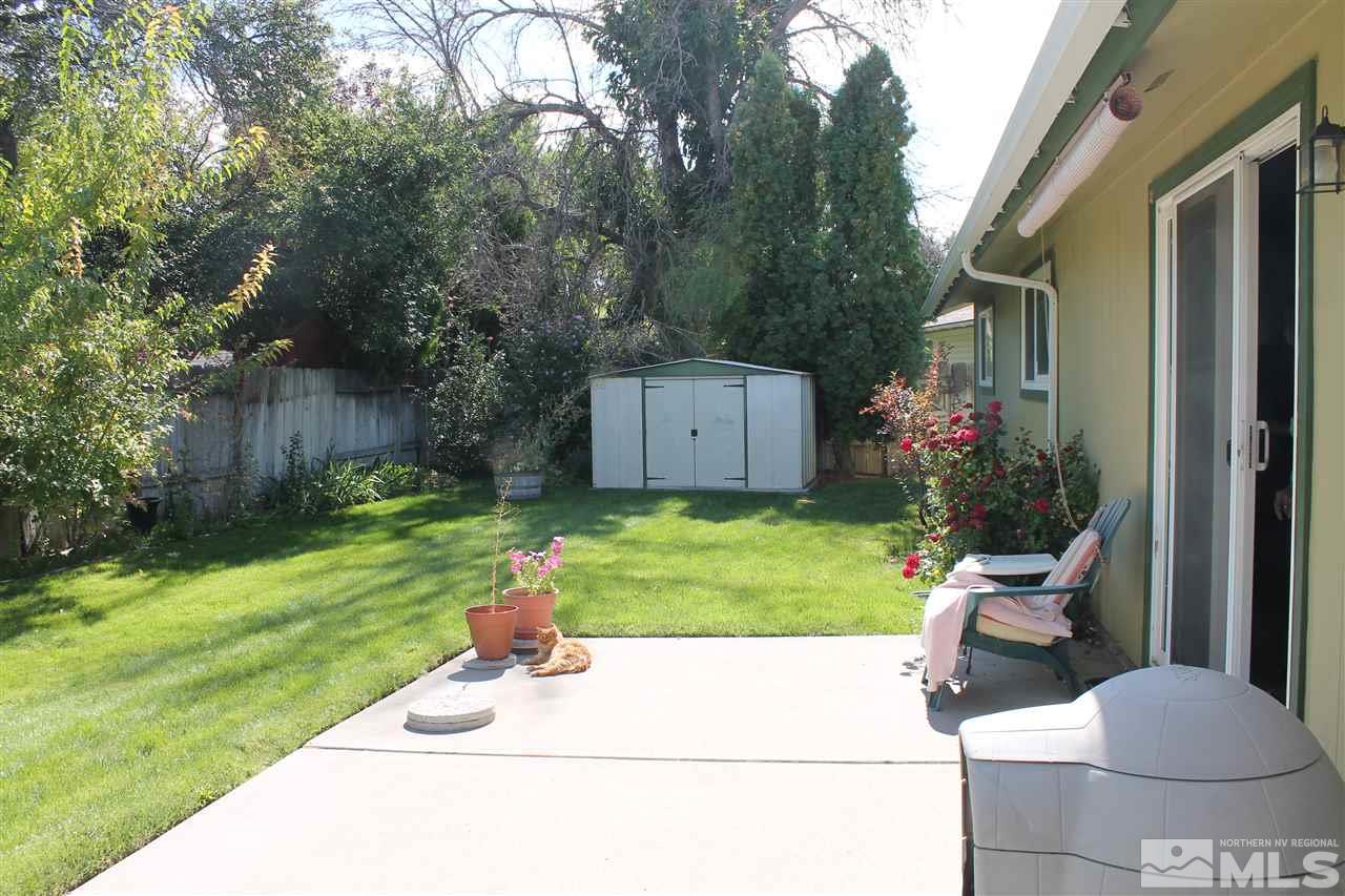 2932 Randolph Drive Reno, NV 89502 - Photo 18 of 21 a view of a chair and table in back yard of the house