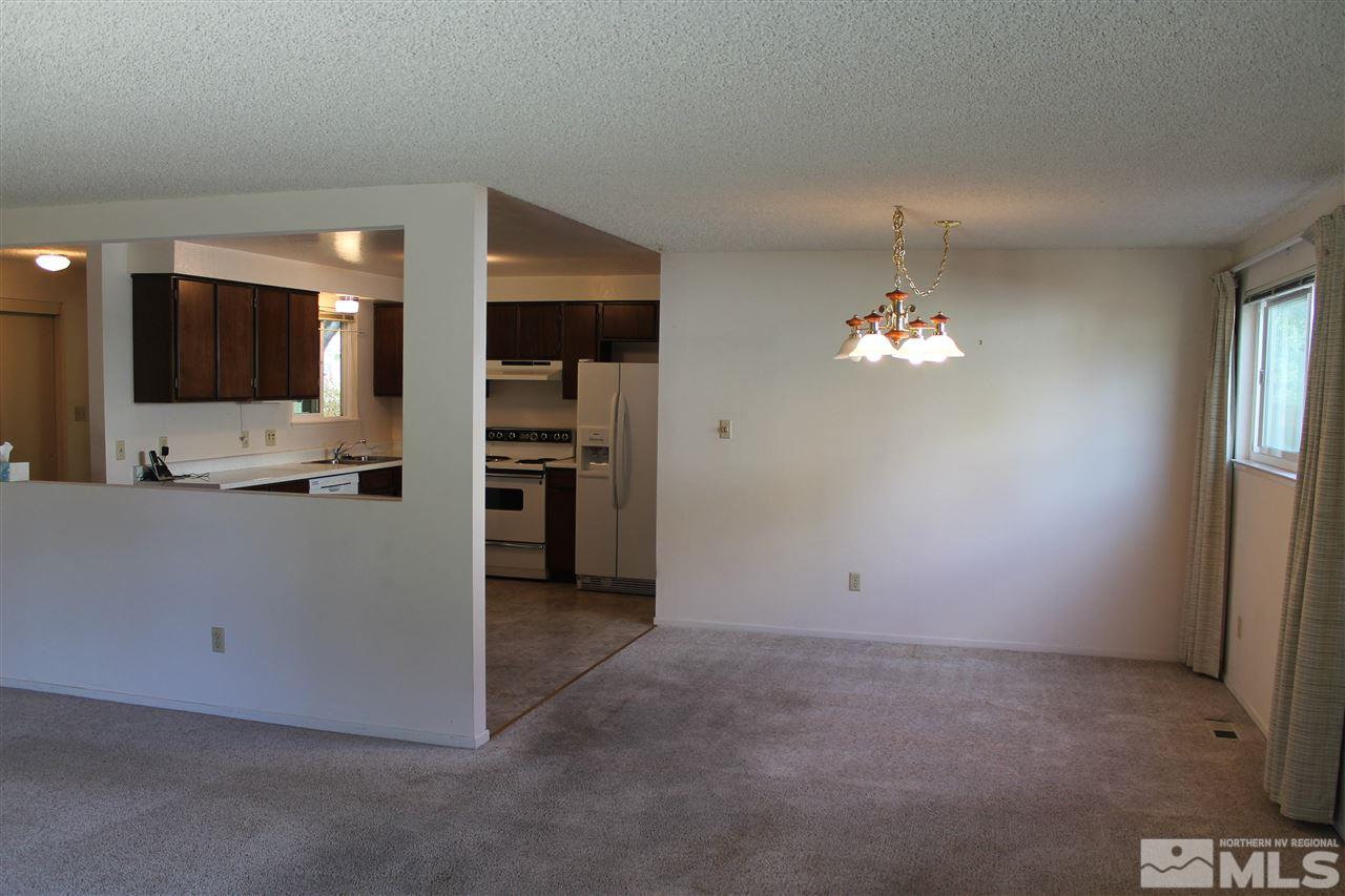 2932 Randolph Drive Reno, NV 89502 - Photo 6 of 21 an empty room with kitchen view and a window