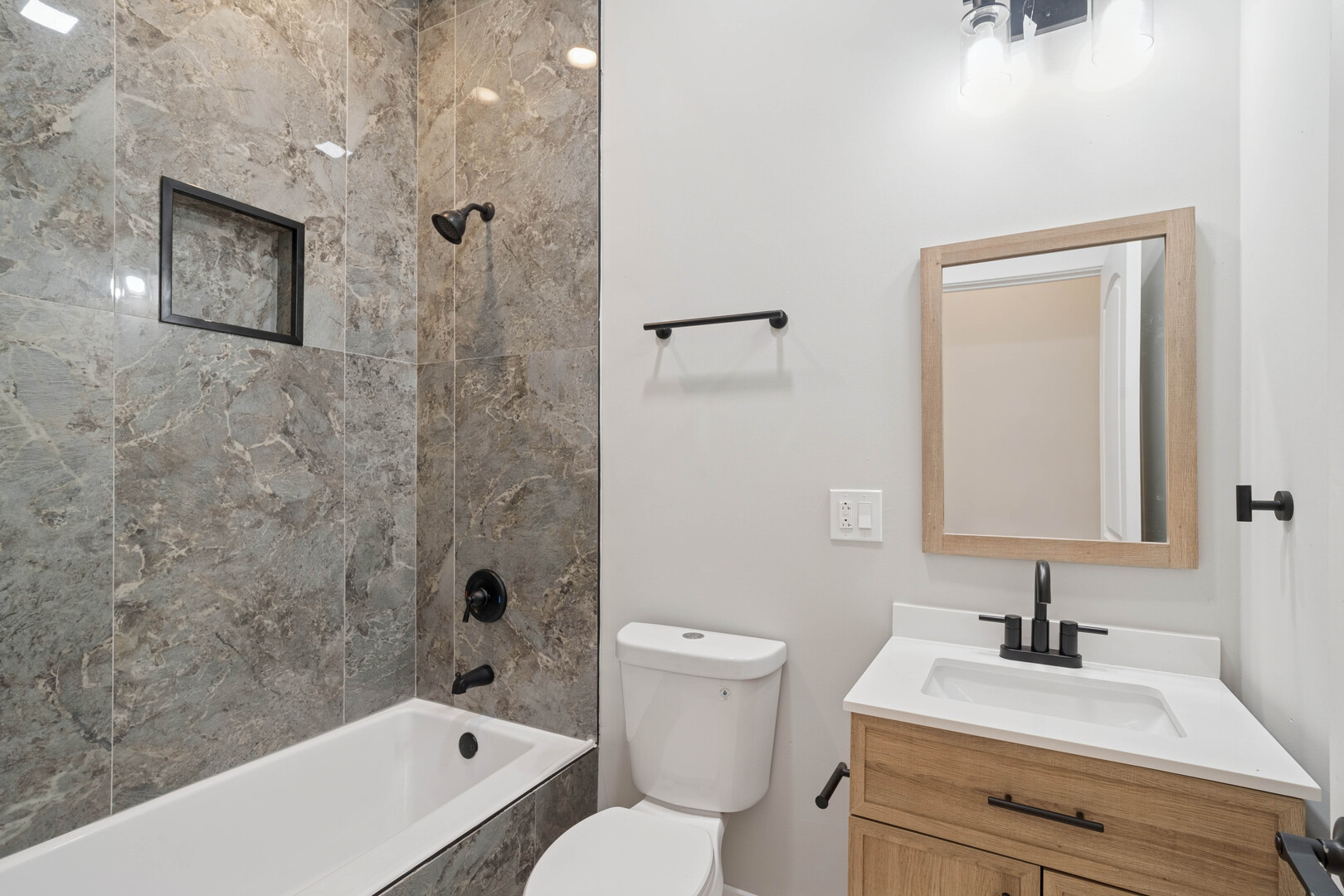 4839 West Huron Street, Unit 1 Chicago, IL 60644 - Photo 13 of 19 a bathroom with a sink toilet vanity and shower
