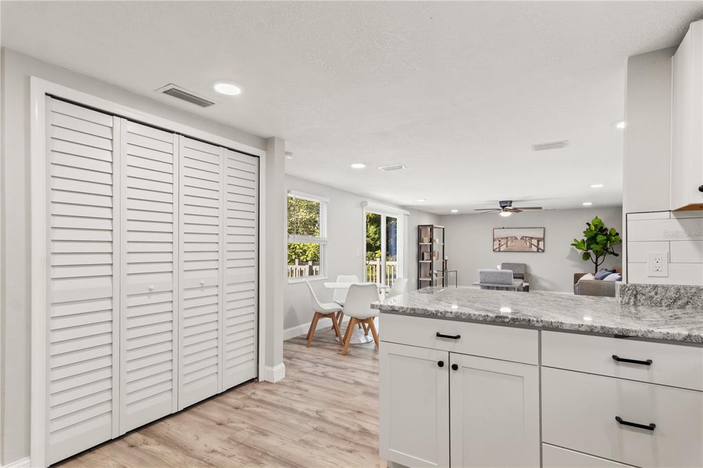 2716 Berdetta Street Leesburg, FL 34748 - Photo 5 of 35 a bathroom with a granite countertop sink and a mirror