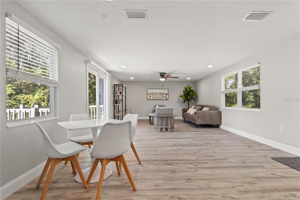 2716 Berdetta Street Leesburg, FL 34748 - Photo 7 of 35 a living room with furniture and a wooden floor