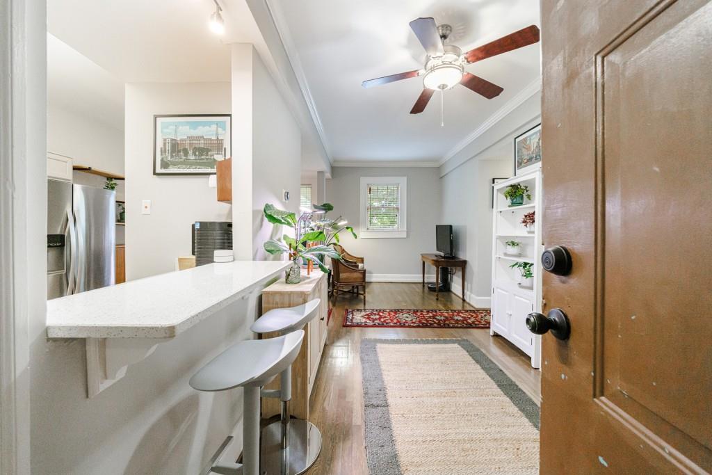 2855 Peachtree Road, Unit 208 Atlanta, GA 30305 - Photo 1 of 1 a dining room with furniture and a chandelier