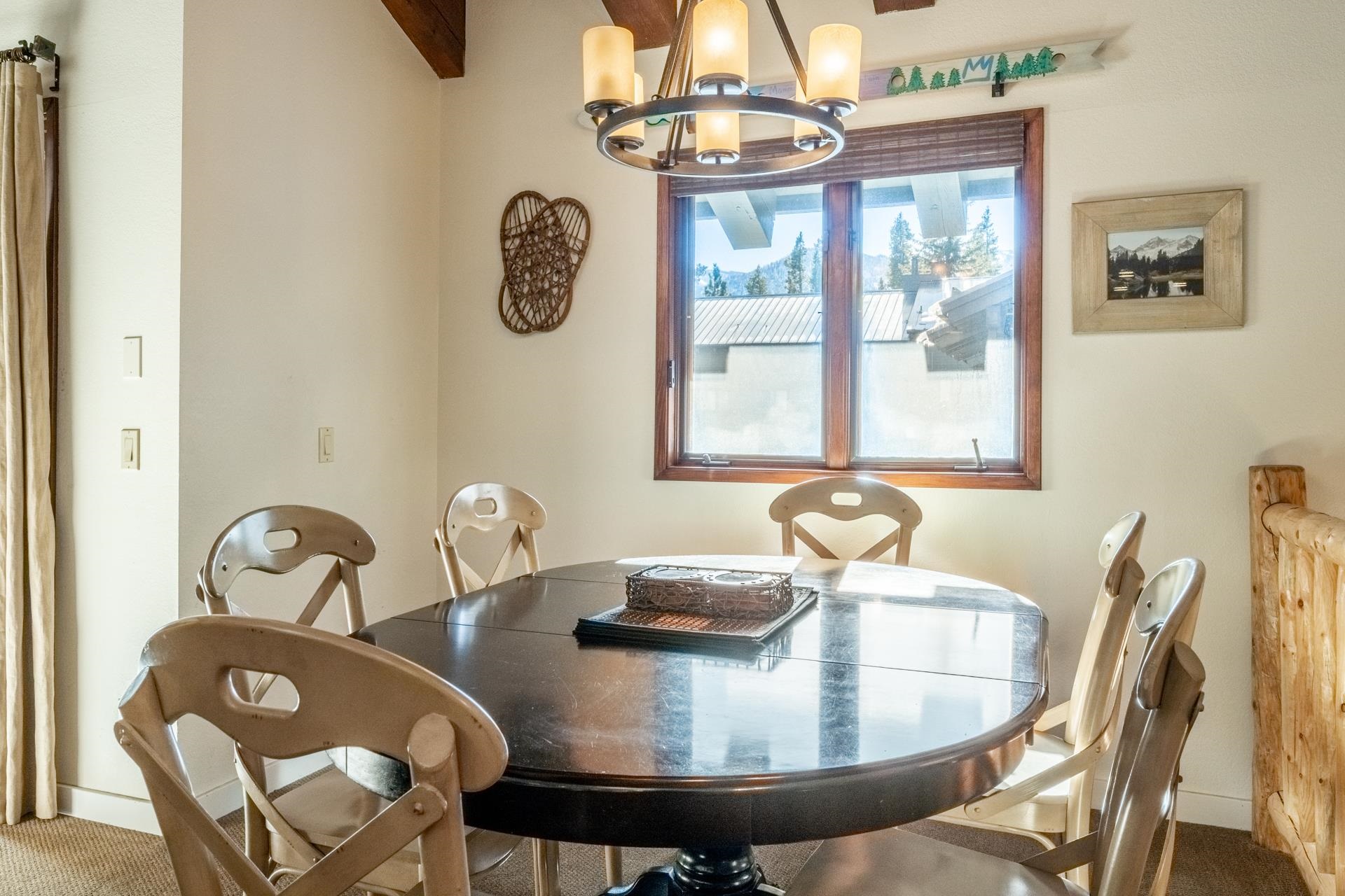 484 Manzanita Road, Unit 9 Mammoth Lakes, CA 93546 - Photo 24 of 39 a dining room with furniture and window
