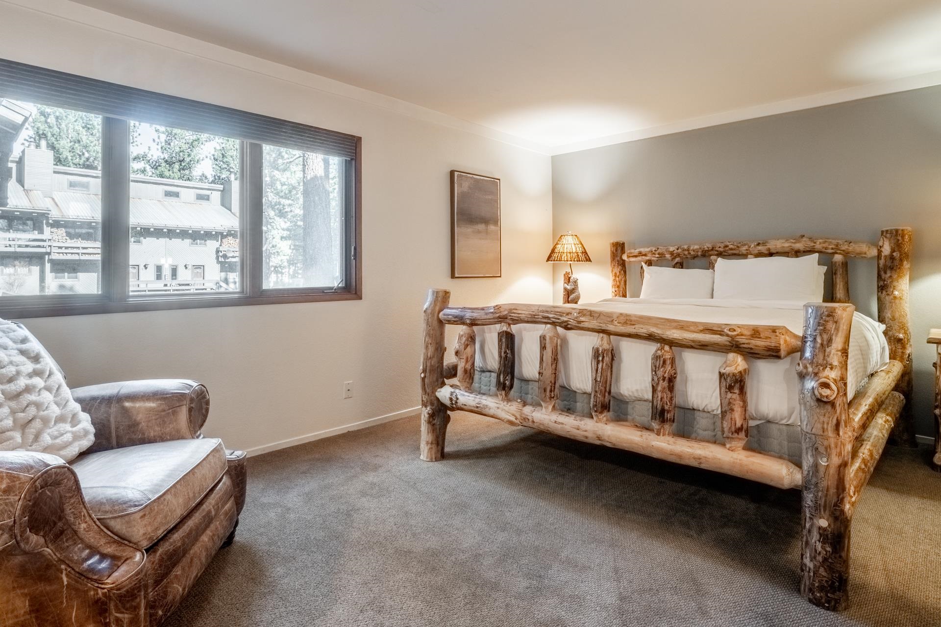484 Manzanita Road, Unit 9 Mammoth Lakes, CA 93546 - Photo 4 of 39 a white bed sitting in a room next to a window