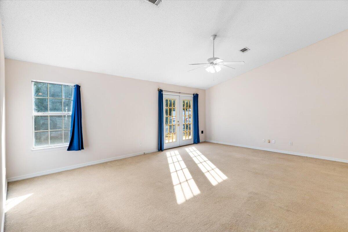 4640 Bobolink Way Crestview, FL 32539 - Photo 14 of 39 an empty room with windows and closet