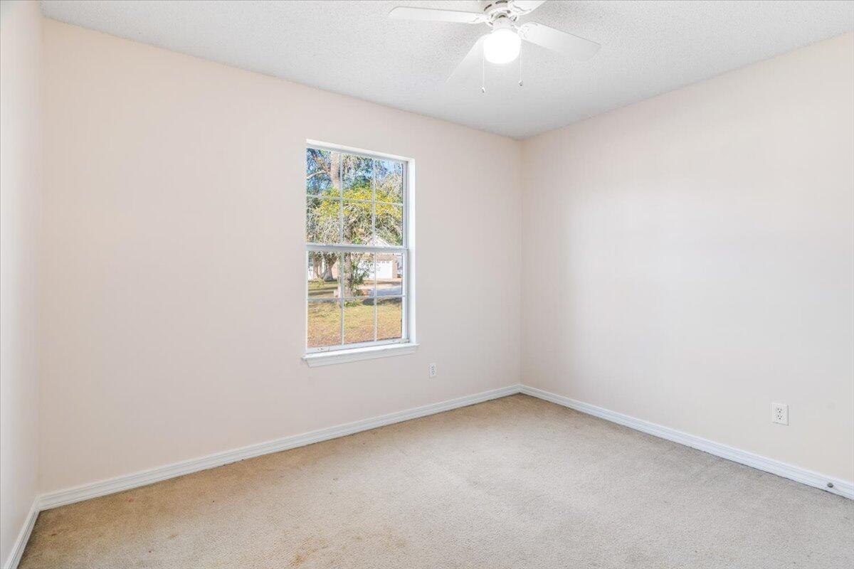 4640 Bobolink Way Crestview, FL 32539 - Photo 18 of 39 an empty room with a window