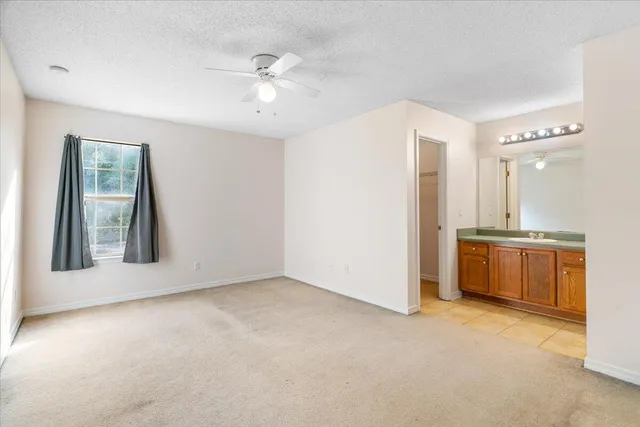 a view of an empty room with a bathroom