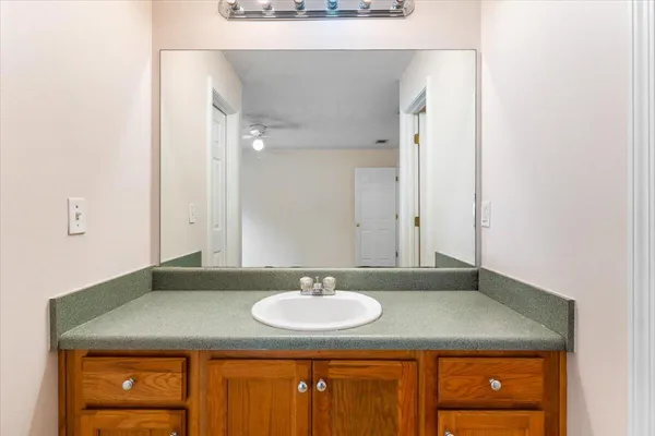 a bathroom with a sink and a mirror