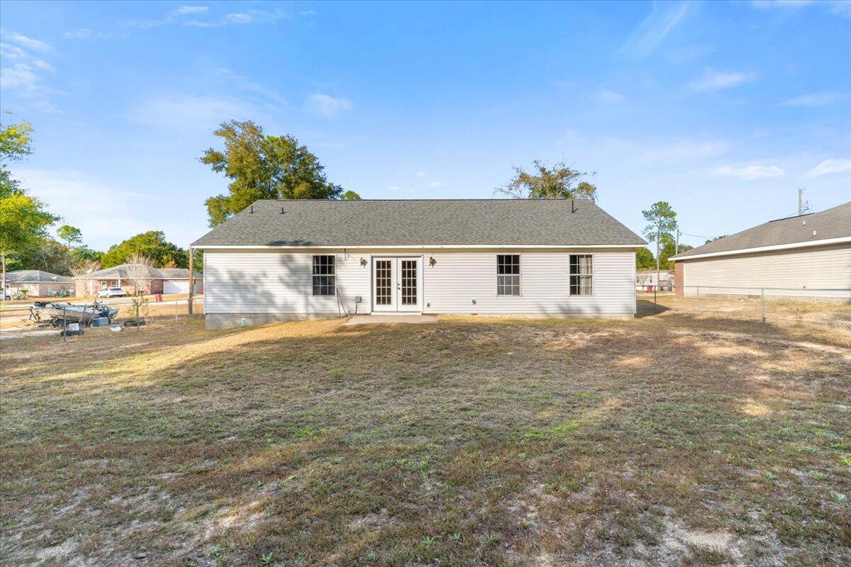 4640 Bobolink Way Crestview, FL 32539 - Photo 35 of 39 a front view of a house with a garden