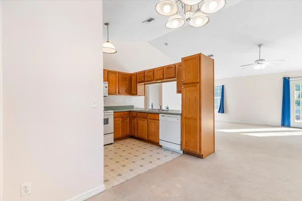 a kitchen with stainless steel appliances a refrigerator and cabinets