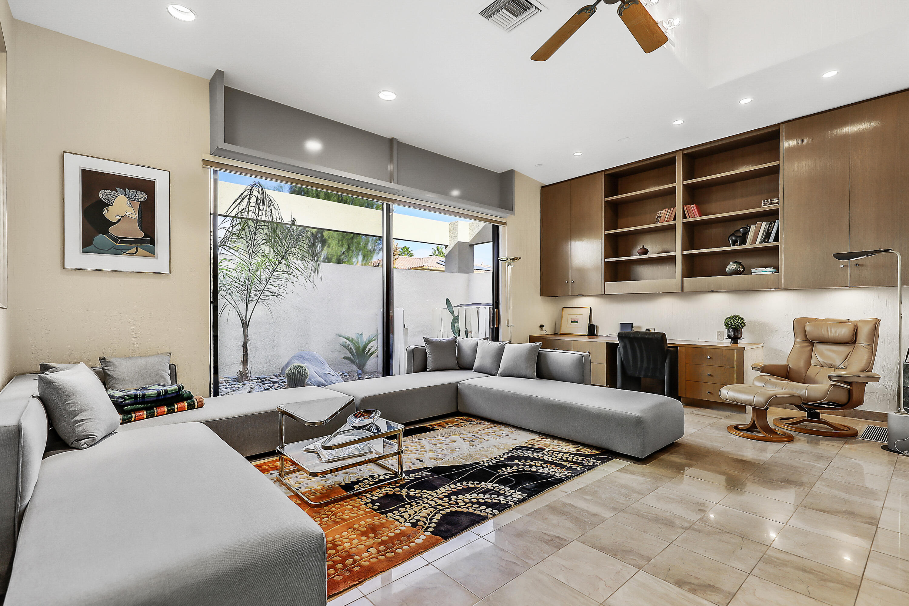 71000 Los Altos Court Rancho Mirage, CA 92270 - Photo 18 of 46 a living room with furniture gym equipment and a large window