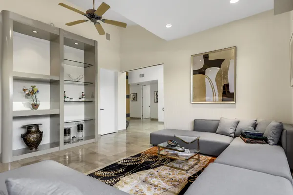 a living room with furniture and a fireplace
